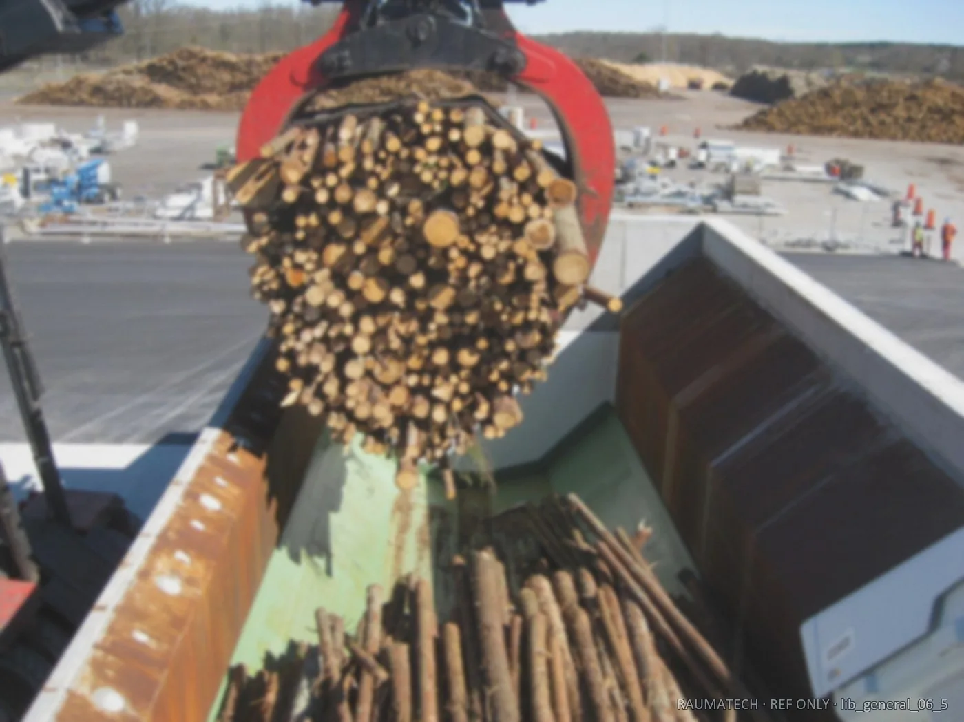 Log feed into chipper